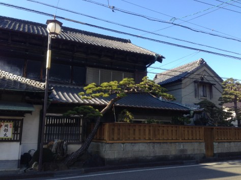 OKABE-5-right-across-the-bus-stop